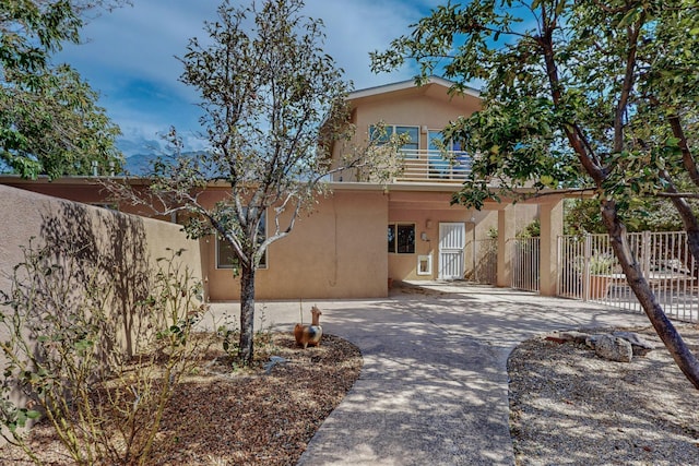 view of front of home featuring a balcony