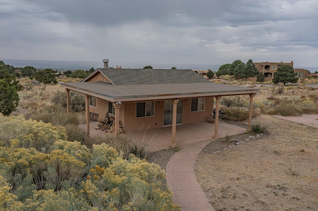 back of house featuring a patio