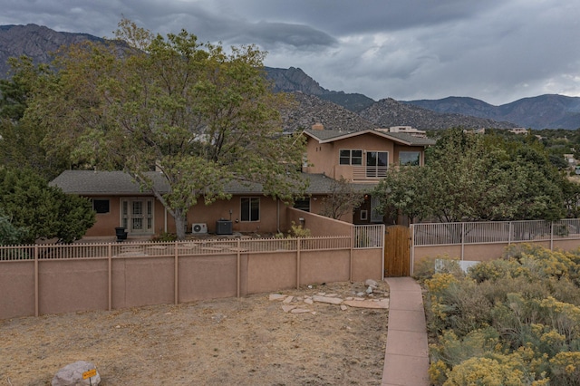 exterior space featuring a mountain view and central AC