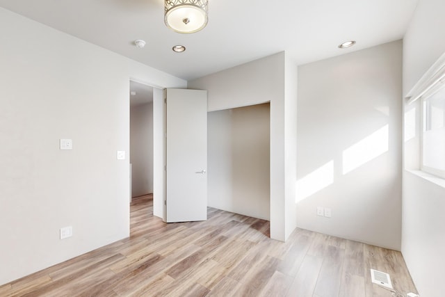 unfurnished bedroom featuring light hardwood / wood-style floors