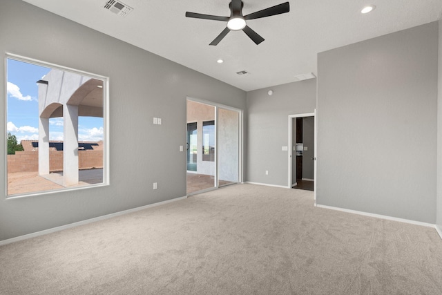 interior space with ceiling fan and light carpet