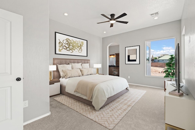 carpeted bedroom featuring ceiling fan