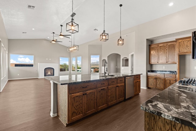 kitchen featuring a spacious island, hanging light fixtures, stainless steel dishwasher, and dark hardwood / wood-style flooring