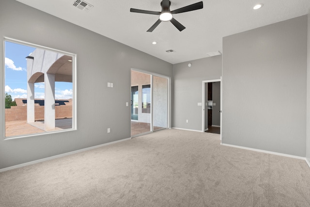 unfurnished room with carpet and ceiling fan