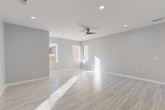 spare room with ceiling fan