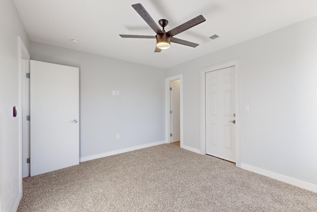 unfurnished bedroom featuring ceiling fan and carpet