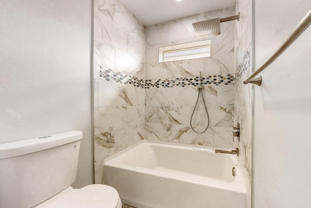 bathroom with toilet and tiled shower / bath combo