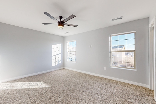 carpeted empty room with ceiling fan