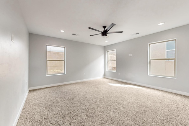 empty room featuring carpet and ceiling fan