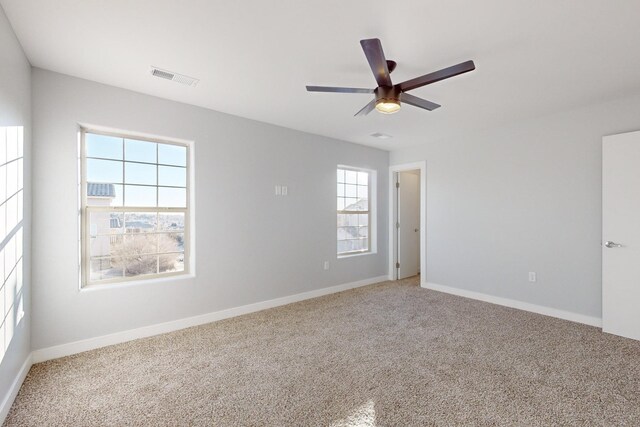 13601 Covered Wagon Ave SE, Albuquerque, NM 87123 - carpeted empty room featuring baseboards, a ceiling fan, and visible vents