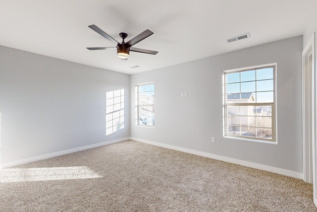 13601 Covered Wagon Ave SE, Albuquerque, NM 87123 - unfurnished bedroom with light carpet, baseboards, visible vents, and recessed lighting
