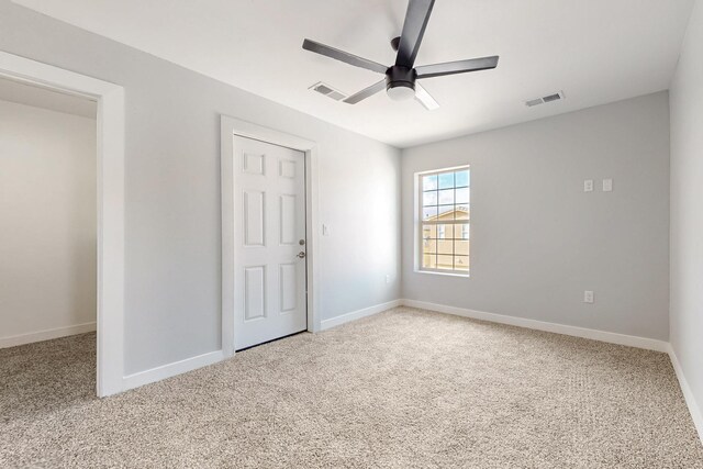 13601 Covered Wagon Ave SE, Albuquerque, NM 87123 - unfurnished bedroom featuring baseboards, connected bathroom, a closet, and light colored carpet