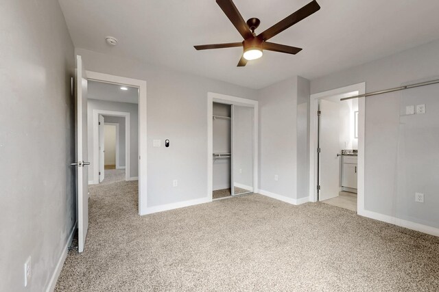 13601 Covered Wagon Ave SE, Albuquerque, NM 87123 - unfurnished bedroom featuring connected bathroom, light carpet, a ceiling fan, and baseboards