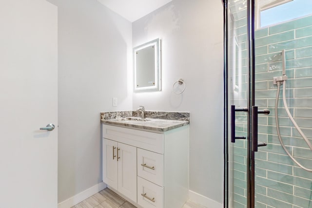 bathroom featuring vanity and walk in shower