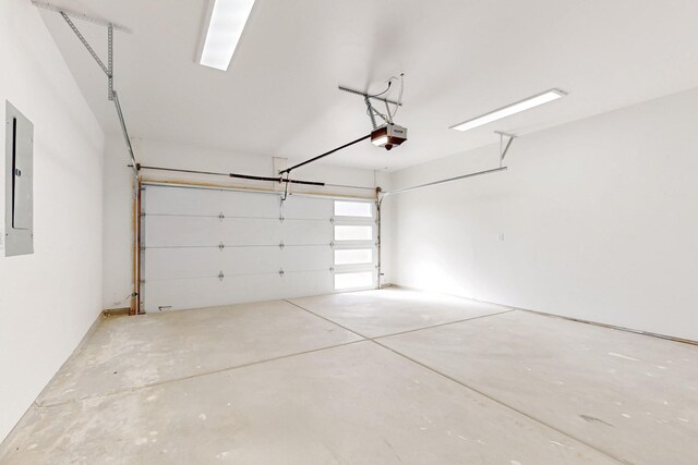 13601 Covered Wagon Ave SE, Albuquerque, NM 87123 - garage featuring electric panel and a garage door opener
