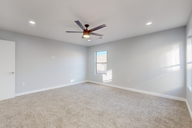 carpeted empty room with ceiling fan