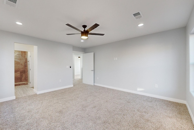 carpeted empty room featuring ceiling fan