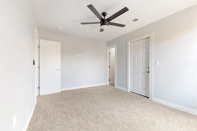 carpeted empty room with ceiling fan