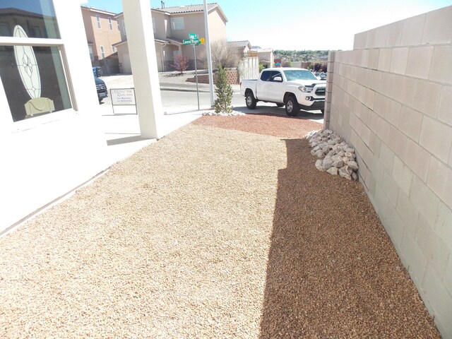 13601 Covered Wagon Ave SE, Albuquerque, NM 87123 - unfurnished bedroom featuring visible vents, carpet flooring, baseboards, and a ceiling fan