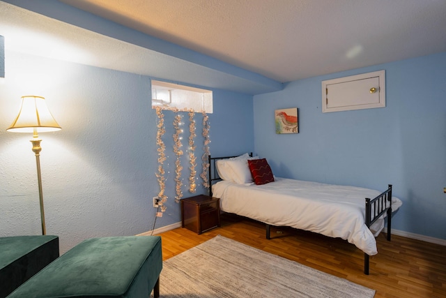 bedroom featuring hardwood / wood-style flooring