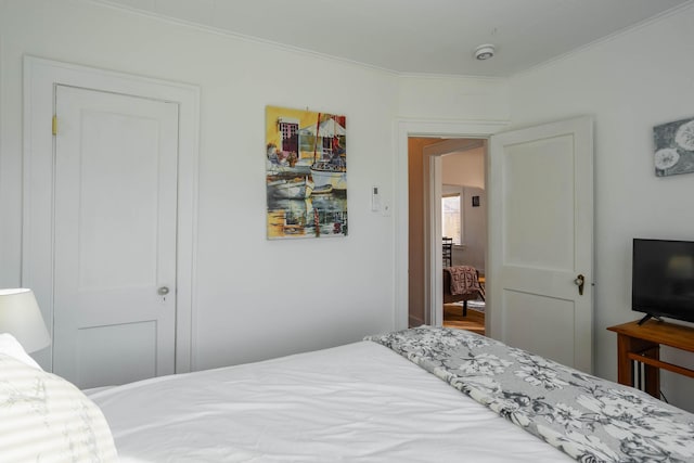 bedroom with ornamental molding