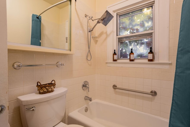 bathroom with toilet, tile walls, and shower / bath combo