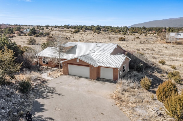 birds eye view of property with a mountain view