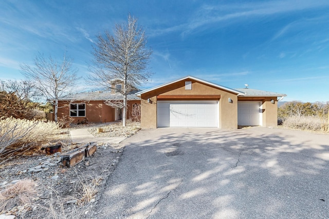 ranch-style home with a garage