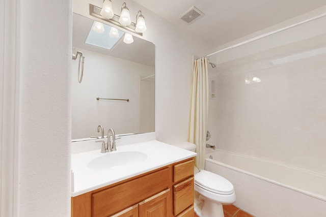 full bathroom featuring tile patterned floors, vanity, shower / bath combo, and toilet