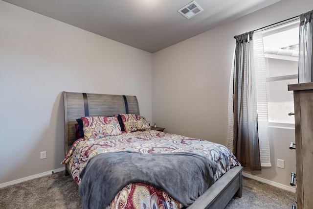 carpeted bedroom featuring multiple windows