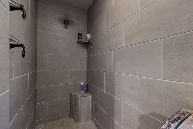 bathroom with a tile shower