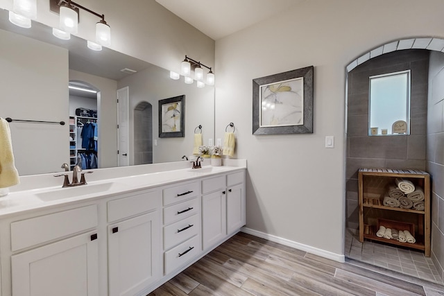 bathroom featuring vanity and hardwood / wood-style flooring