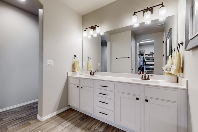 bathroom featuring vanity and wood-type flooring