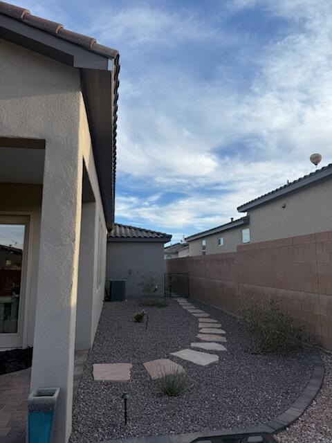 view of yard featuring a patio and central AC unit