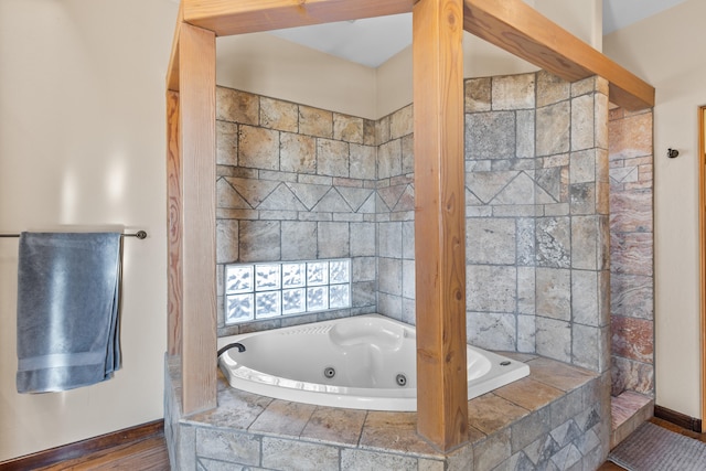 bathroom featuring tiled bath