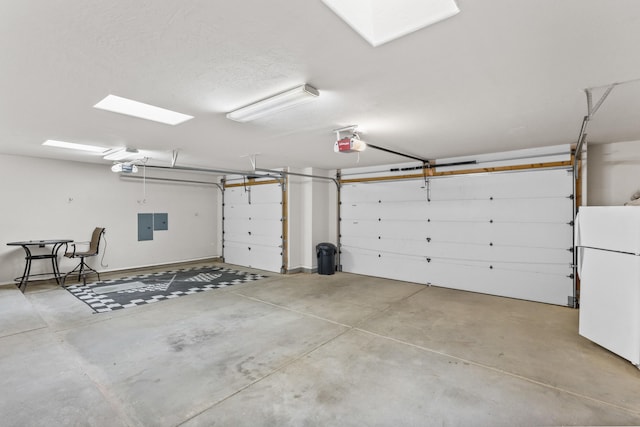 garage with electric panel, a garage door opener, and white refrigerator