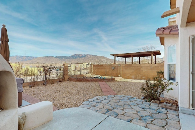 view of yard with a patio area and a mountain view