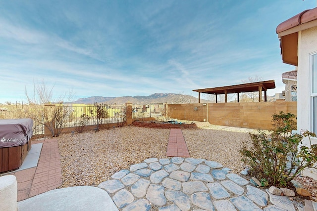 view of yard with a mountain view and a patio