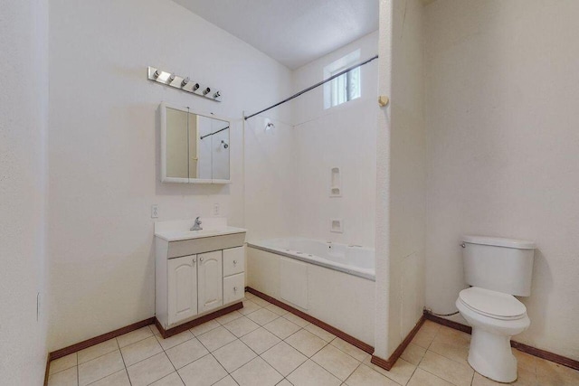 full bathroom with tile patterned floors, vanity, tiled shower / bath combo, and toilet