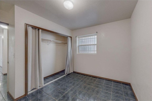 unfurnished bedroom featuring a closet