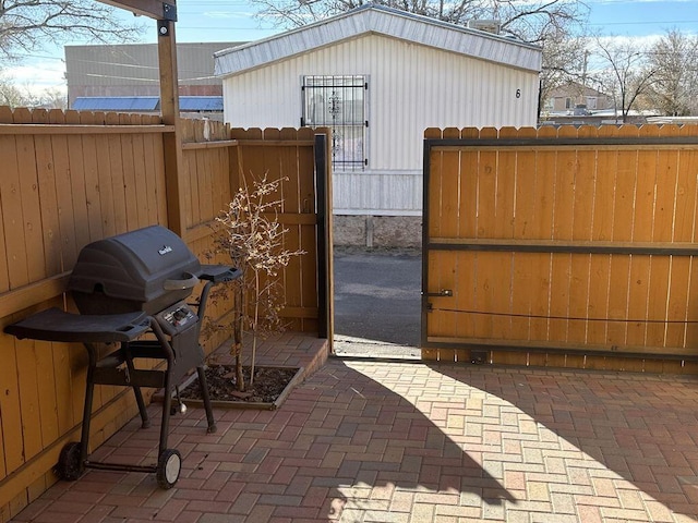 view of patio featuring a grill