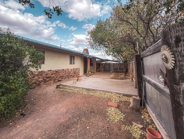 view of yard featuring a deck and a fenced backyard