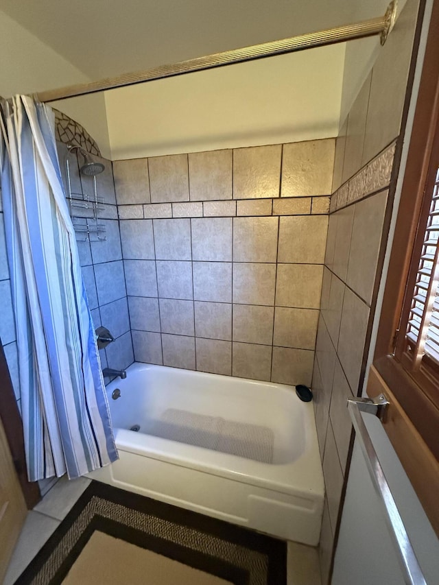 bathroom with shower / bath combination with curtain