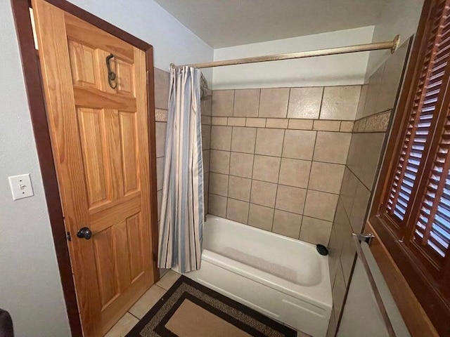 bathroom featuring shower / tub combo and tile patterned flooring