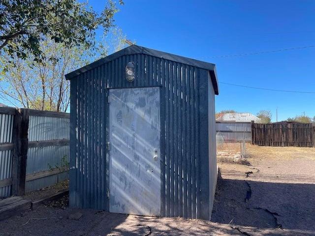 view of shed with a fenced backyard