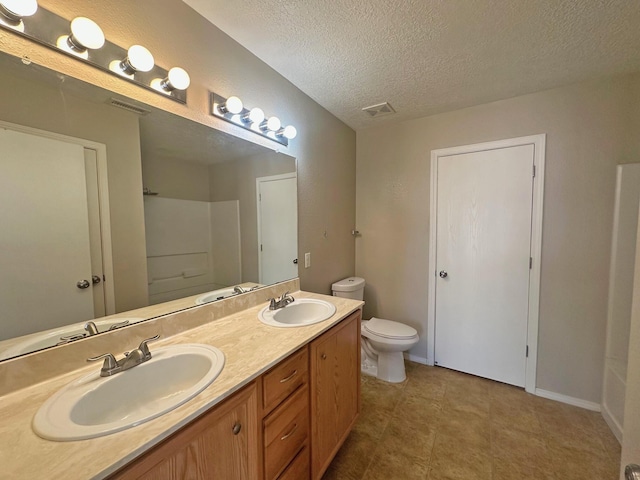 full bathroom with toilet, shower with separate bathtub, vanity, and a textured ceiling