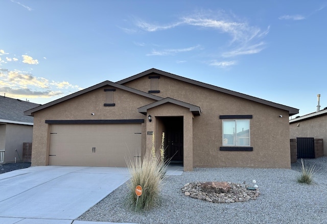 ranch-style house featuring a garage