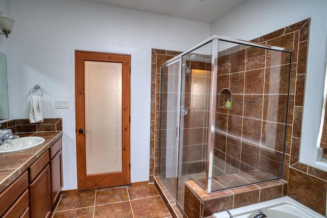 bathroom with vanity and an enclosed shower