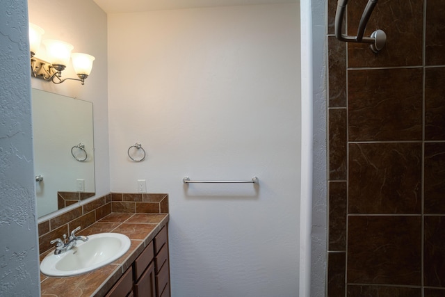 bathroom featuring tasteful backsplash and vanity