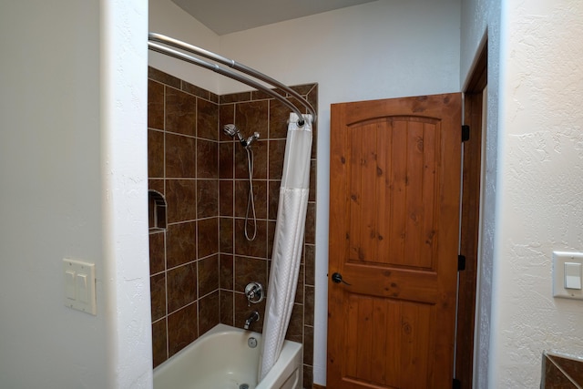 bathroom featuring shower / bath combo with shower curtain